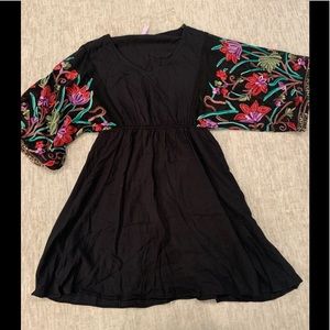 Black dress with embroidered sleeves